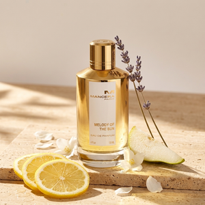 Mancera Melody of the Sun EDP kvepalų buteliukas citrusų ir žiedų kompozicijoje – Aromatale